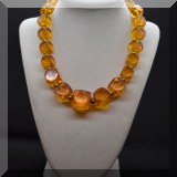 J138. Amber colored Bakelite or other plastic necklace with square beads. - $28 